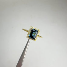 Load and play video in Gallery viewer, 5 x 7 mm. Octagon Cut London Blue Brazilian Topaz with Cz Halo Ring
