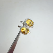 Load and play video in Gallery viewer, 6 x 8 mm. Oval Cut Yellow Brazilian Citrine with Cz Halo Earrings
