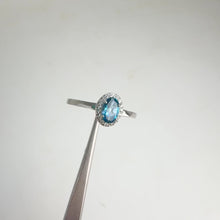 Load and play video in Gallery viewer, 4 x 6 mm. Oval Cut London Blue Brazilian Topaz with Cz Halo Ring
