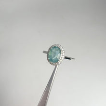 Load and play video in Gallery viewer, 6 x 8 mm. Oval Cut Green Zambian Emerald with Cz Halo Ring
