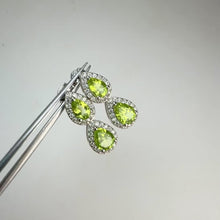 Load and play video in Gallery viewer, 5 x 7 mm. Pear Cut Green Pakistani Peridot with Cz Halo Earrings
