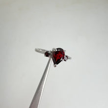 Load and play video in Gallery viewer, 5 x 7 mm. Pear Cut Red Mozambican Garnet Trilogy Ring
