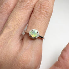 Load and play video in Gallery viewer, 5 mm. Round Cut Multi-coloured Ethiopian Opal with Cz Halo Ring
