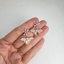 Load and play video in Gallery viewer, 6 x 9 mm. Pear Cut Very Light Pink African Rose Quartz with Cz Accents Drop Bee Earrings
