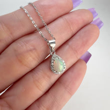 Load and play video in Gallery viewer, 5 x 7 mm. Pear Cabochon Multi-coloured Ethiopian Opal with Cz Halo Pendant and Necklace
