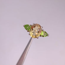 Load and play video in Gallery viewer, 8 x 10 mm. Oval Cut Yellow Brazilian Citrine and Peridot Trilogy Ring
