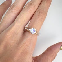 Load and play video in Gallery viewer, 6 mm. Round Cut White Indian Moonstone with Sapphire Accents Ring
