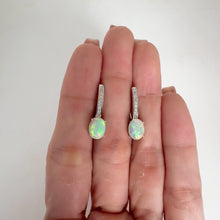 Load and play video in Gallery viewer, 6 x 8 mm. Oval Cabochon Multi-coloured Ethiopian Opal with Cz Accents Earrings
