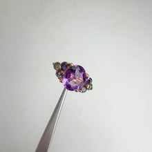 Load and play video in Gallery viewer, 8 x 10 mm. Oval Cut Purple Brazilian Amethyst with Iolite and Sapphire Accents Ring

