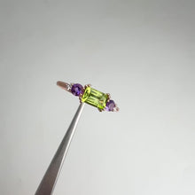 Load and play video in Gallery viewer, 4 x 6 mm. Octagon Cut Green Pakistani Peridot with Amethyst and Cz Accents Ring
