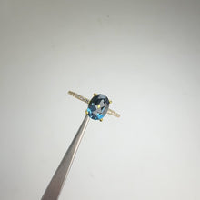 Load and play video in Gallery viewer, 6 x 8 mm. Oval Cut London Blue Brazilian Topaz with Cz Band Ring
