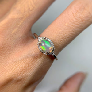 6 x 8 mm. Oval Cabochon Multi-coloured Ethiopian Opal with Cz Halo Ring
